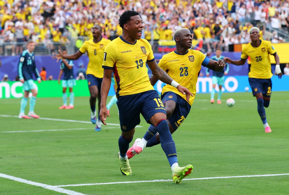 Ecuador's Gonzalo celebrates scoring second goal with Moises. — Reuters