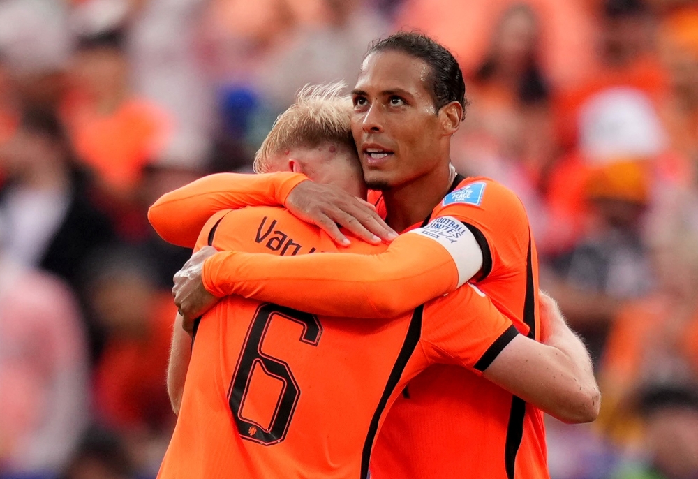  
Netherlands' Virgil van Dijk celebrates after the match with Jan Paul van Hecke . — Reuters