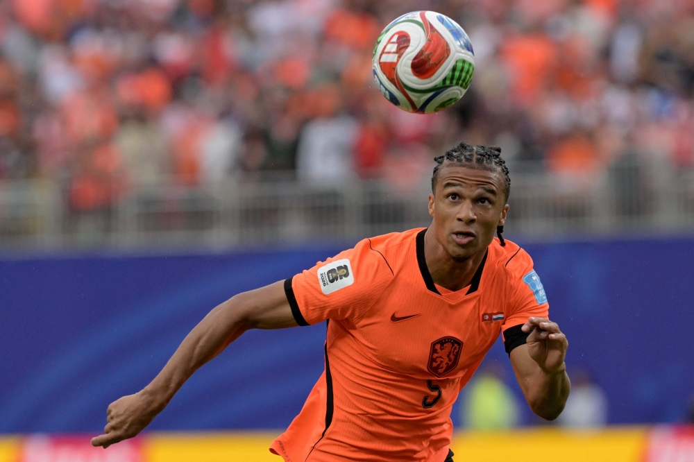 Netherlands' #05 Nathan Ake eyes on the ball. — AFP