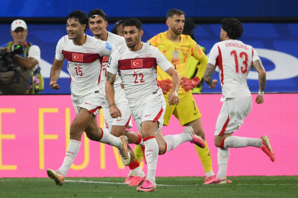 Türkiye's  #22 Kaan Ayhan (C) celebrates after scoring third goal. — AFP