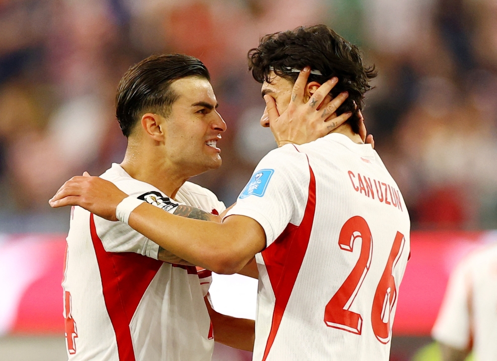  
Türkiye's Bardakci celebrates with Uzun after Kaan Ayhan scores third goal. — Reuters