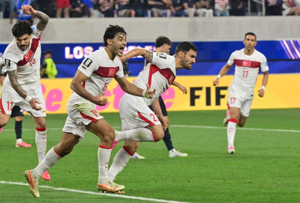 Türkiye's  #22 Kaan Ayhan (R) celebrates after scoring third goal. — AFP