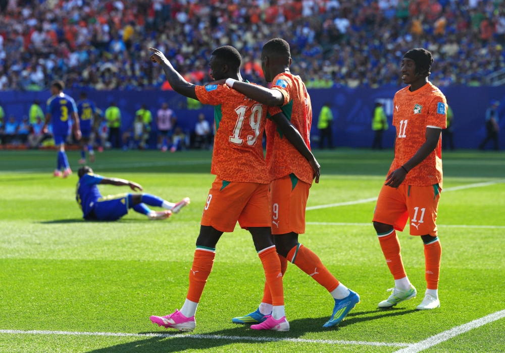  
Ivory Coast's Nicolas celebrates scoring second goal with Ange and Yan. — Reuters  