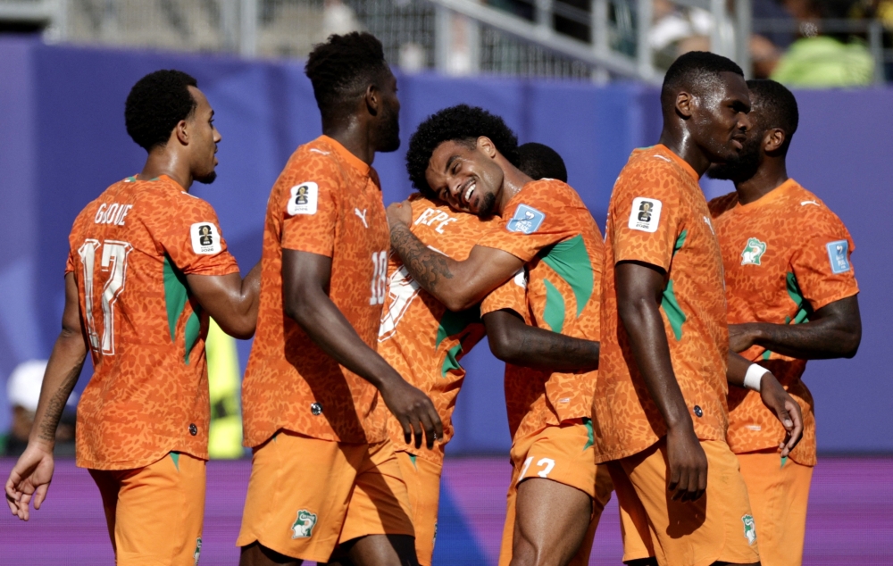  
Ivory Coast's Nicolas celebrates scoring second goal with Christopher . — Reuters  