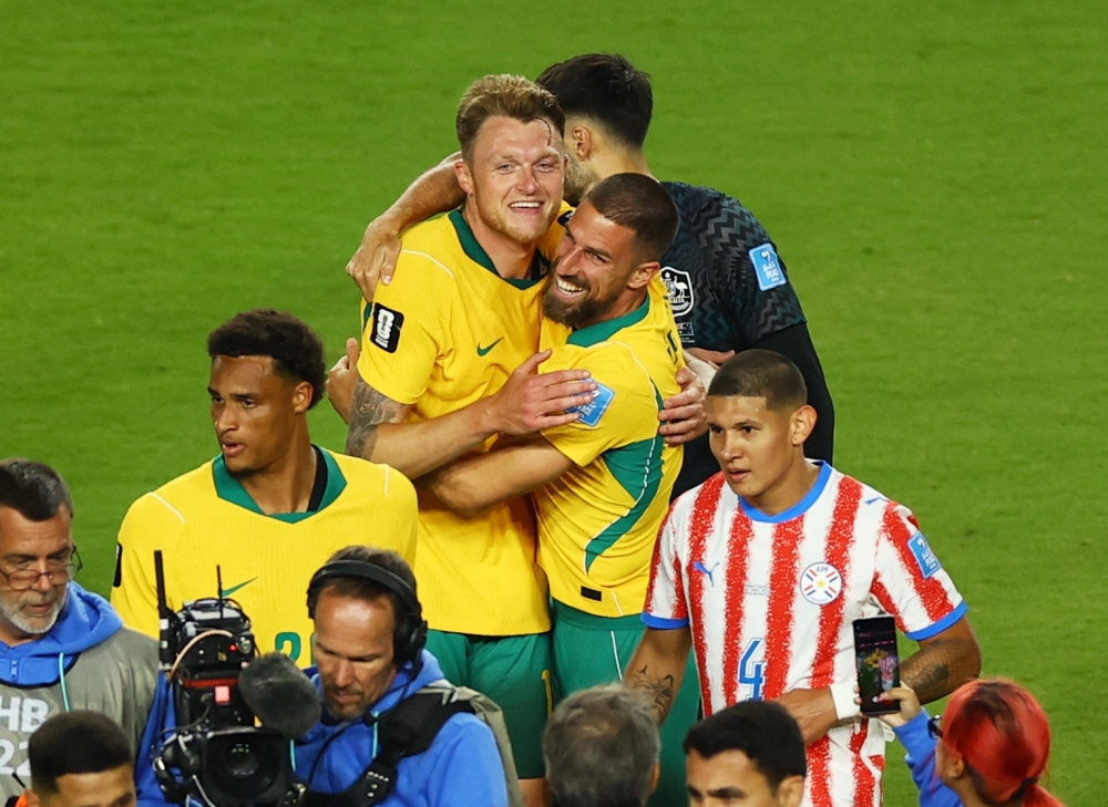  
Australia's Harry and Aziz celebrate after the match. — Reuters 