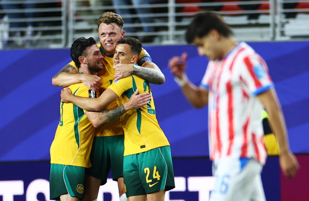  
Australia's Harry Souttar, Aiden O'Neill and Paul Okon Engstler. — Reuters 