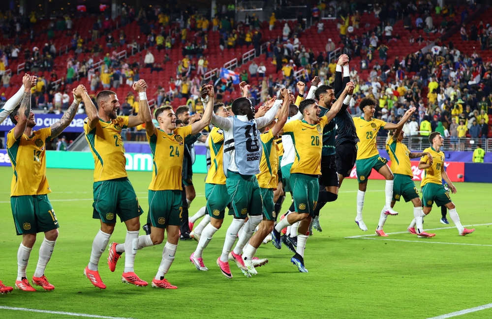  
Australia players celebrate after the match. — Reuters  