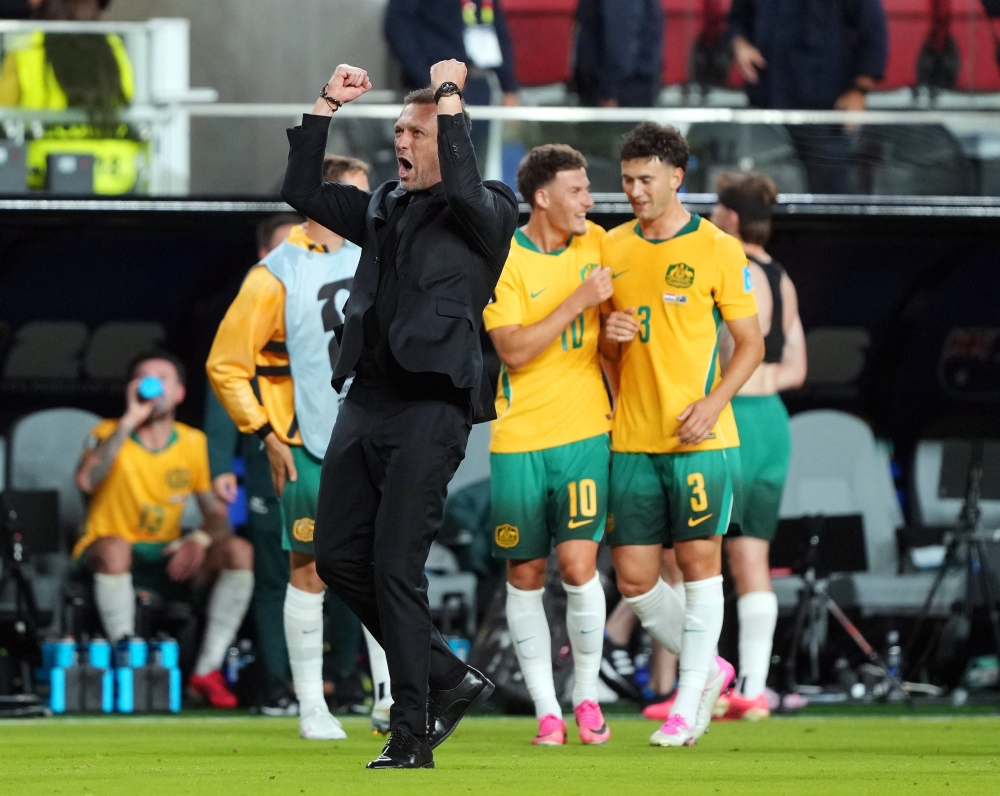  
Australia coach Tony Popovic celebrates after the match. — Reuters