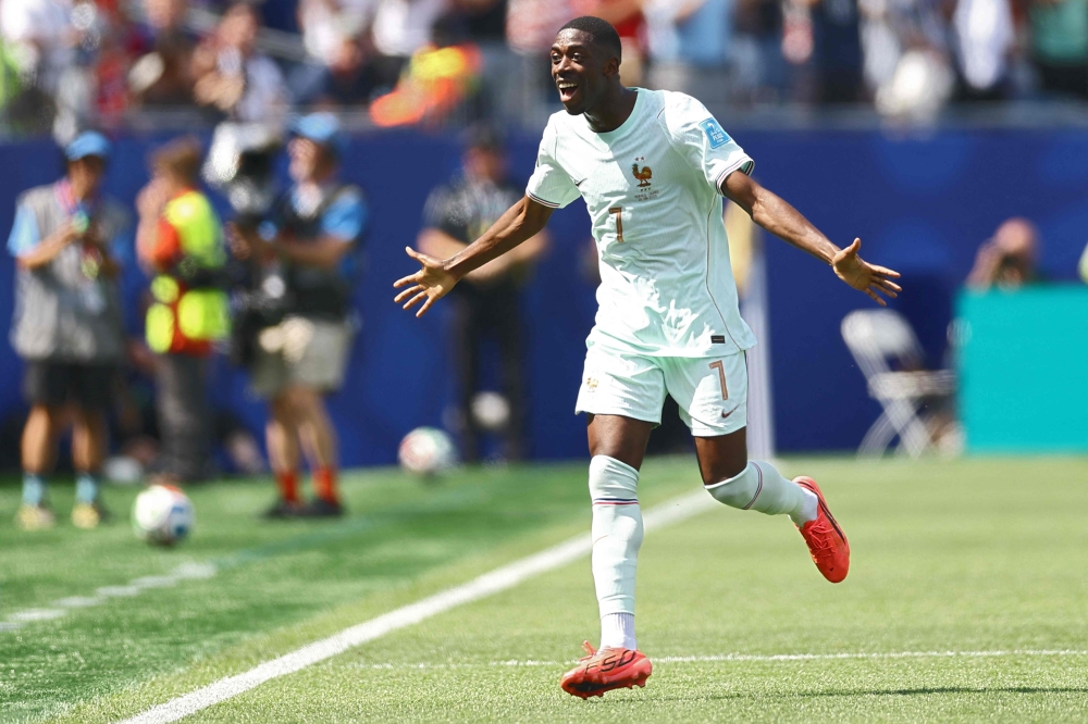 France's #07 Ousmane Dembele celebrates scoring  second goal