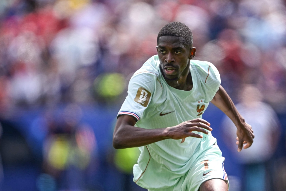France's  #07 Dembele celebrates scoring first goal. — AFP 