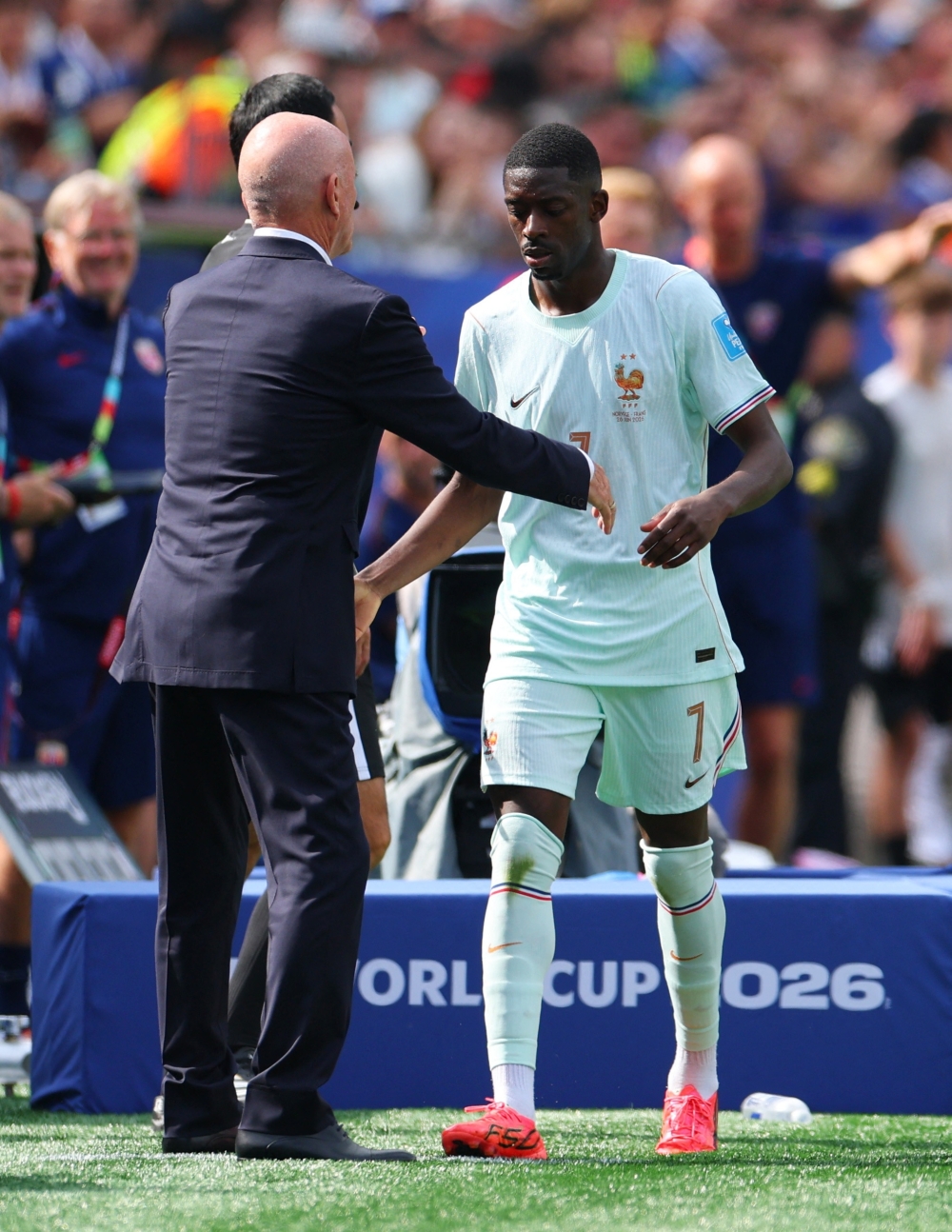  
France's Dembele with interim France coach Guy Stephan. — Reuters 