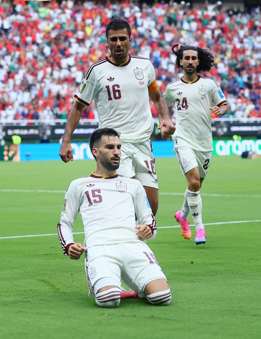 Spain's #15 Baena celebrates scoring  first goal with Marc and Rodri. — Reuters