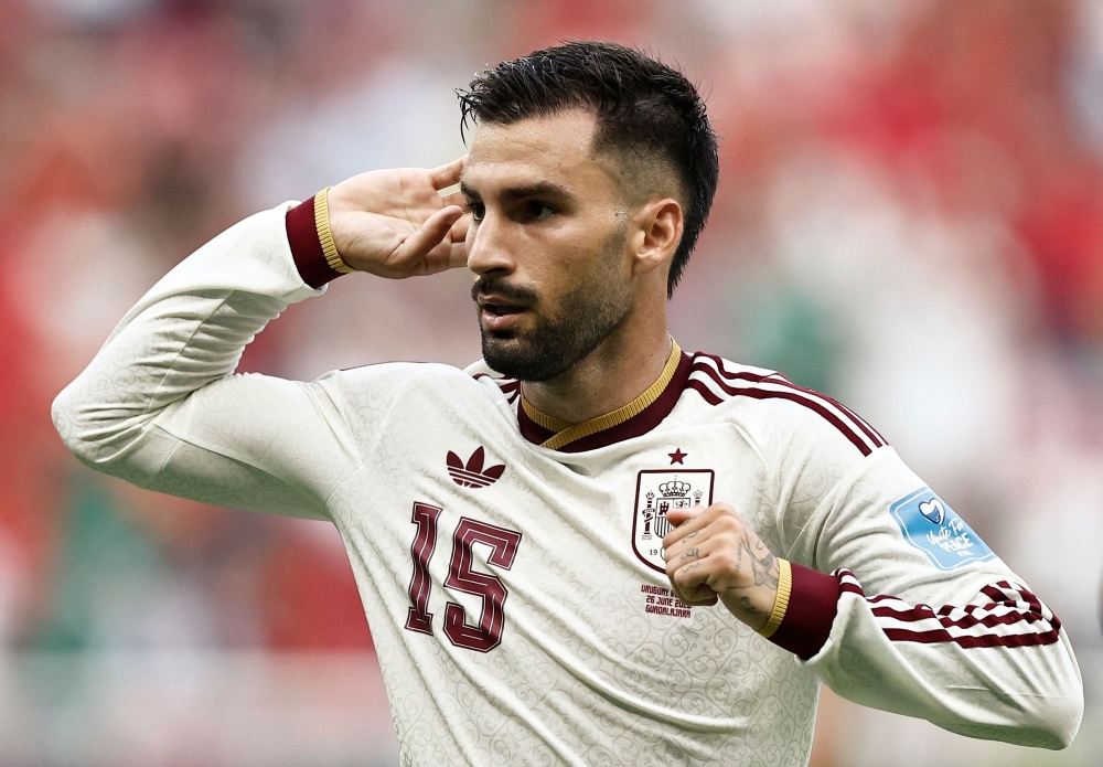  Spain's midfielder #15 Alex Baena celebrates scoring first goal. — AFP