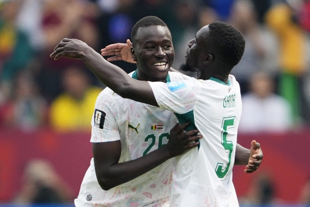 Senegal's #26 Gueye celebrates with teammates. — Reuters