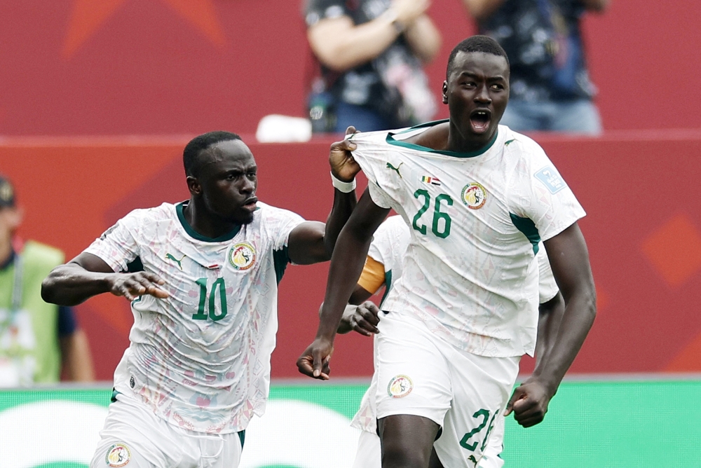 Senegal's #26 Gueye celebrates with teammates. — Reuters