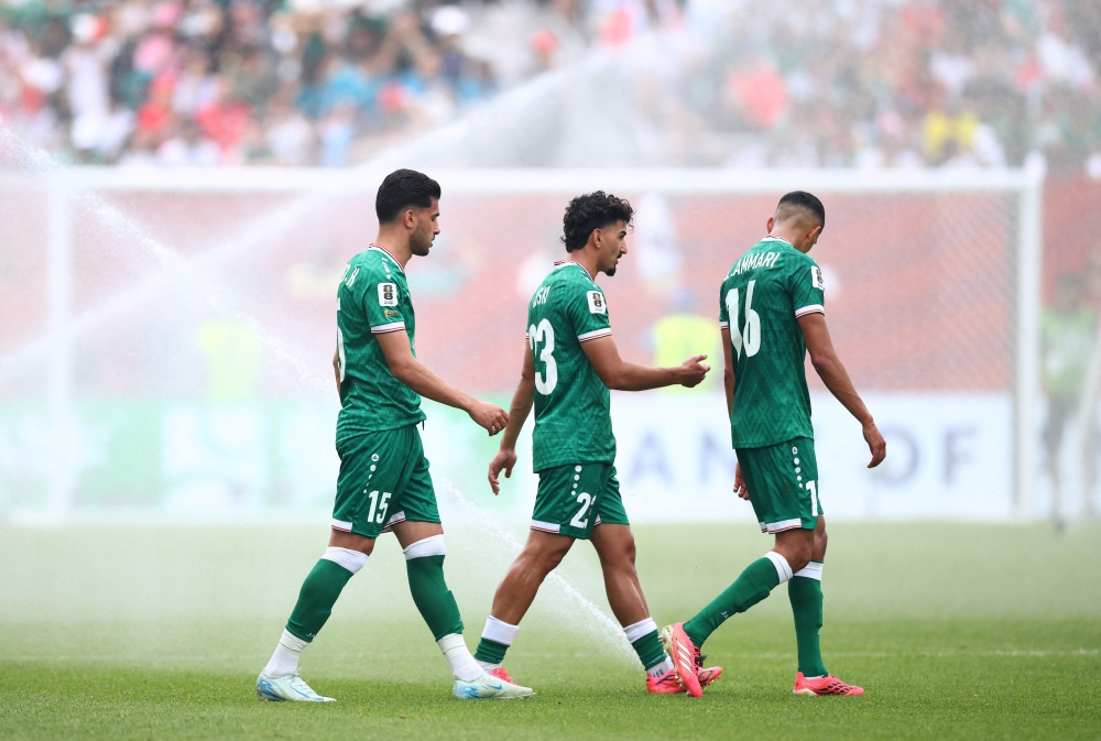  Iraq's #15 Yahya, #23 Doski, and #16 Al Ammari. — AFP