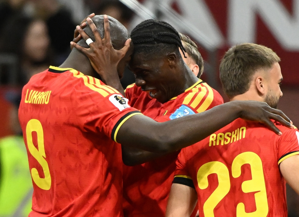  
Belgium's Lukaku celebrates scoring fourth goal with Onana. — Reuters