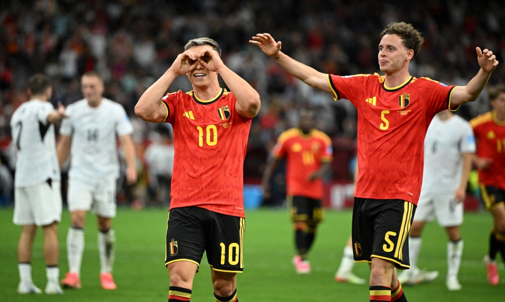  
Belgium's Trossard celebrates scoring second goal with Cuyper. — Reuters