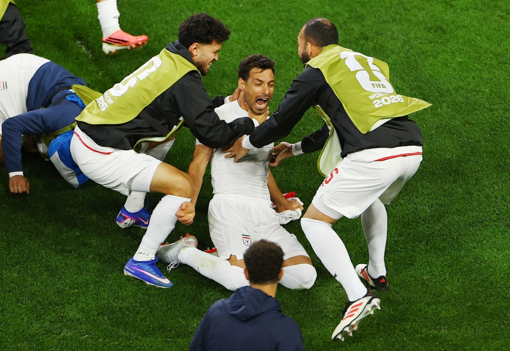  
Iran's Khalilzadeh celebrates with teammates. — Reuters