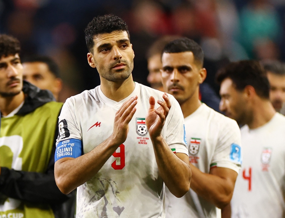  
Iran's Mehdi Taremi applauds fans. — Reuters 