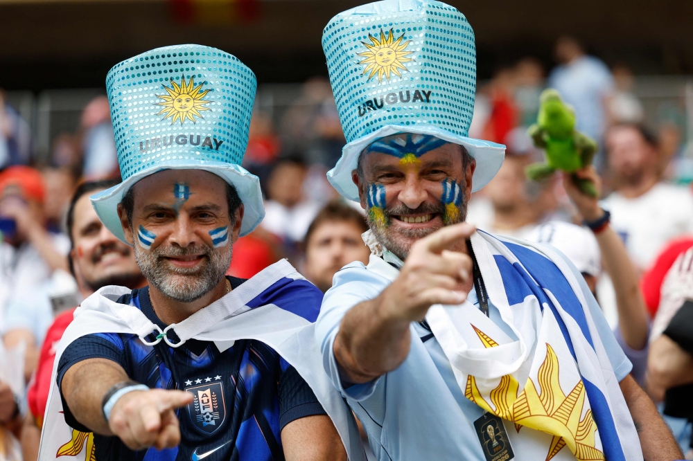 Uruguayan fans cheer ahead of the 2026 World Cup Group H football match between Uruguay and Spain at the Guadalajara Stadium  

