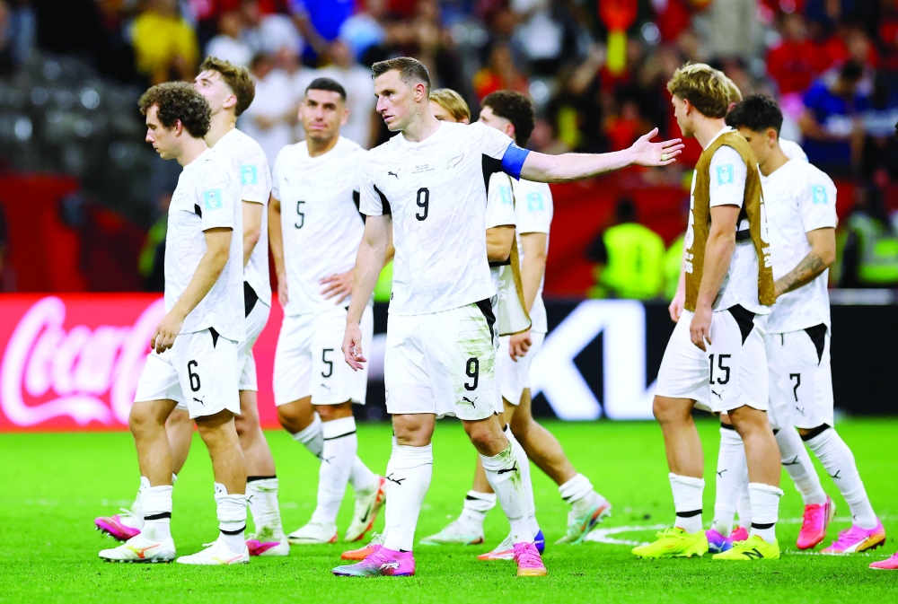  
New Zealand's Chris Wood and teammates look dejected after the match. — Reuters  