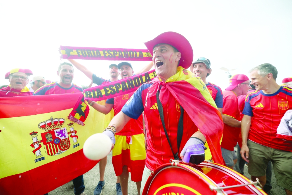  
Spain fans with a drum outside the stadium. — Reuters
