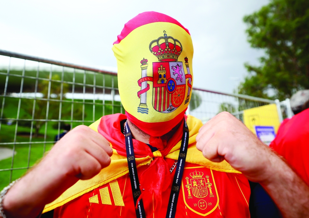  
A Spain fan wears a mask outside the stadium. — Reuters