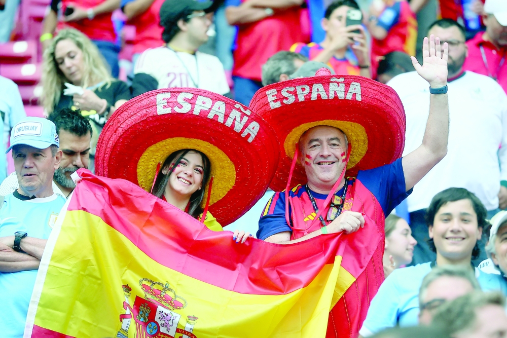  
Spain fans display a flag inside the stadium. — Reuters