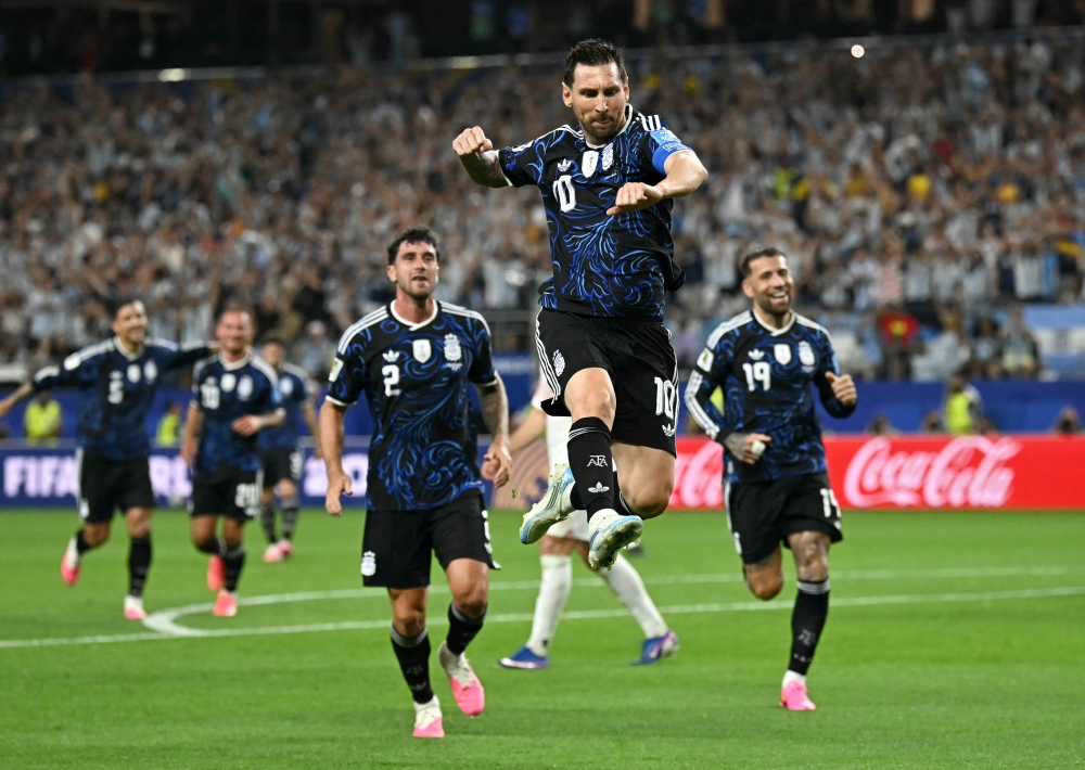  Argentina's #10 Messi celebrates scoring third goal. — Reuters