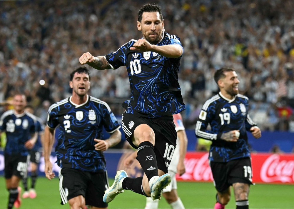 Argentina's #10 Messi celebrates scoring third goal. — Reuters