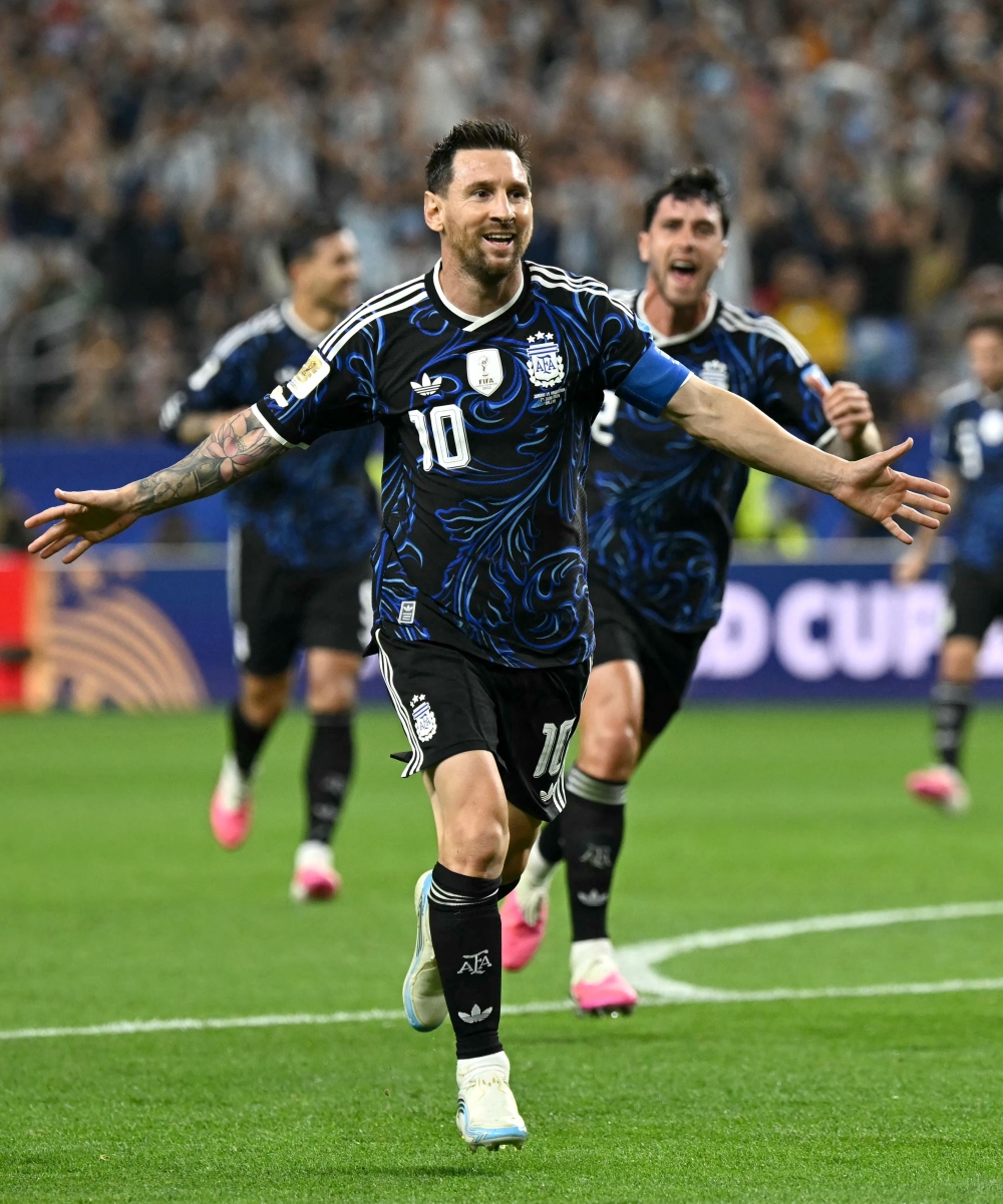 Argentina's #10 Messi celebrates scoring third goal. — AFP
