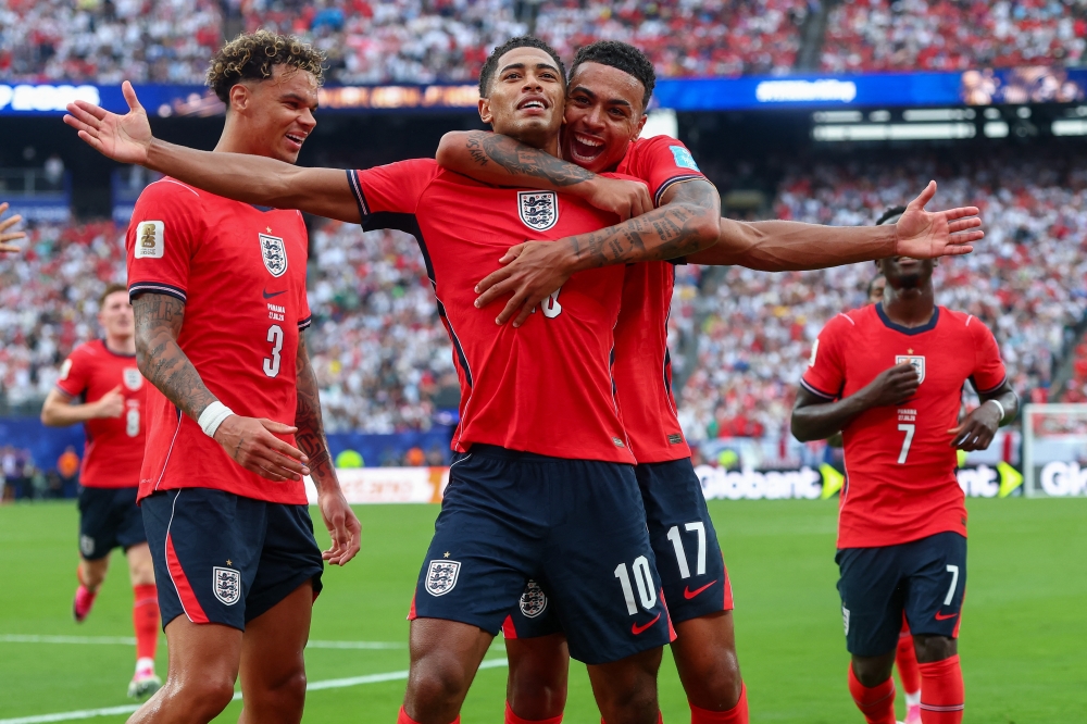 England Bellingham (10) celebrates with teammates after first goal. — Imagn Images