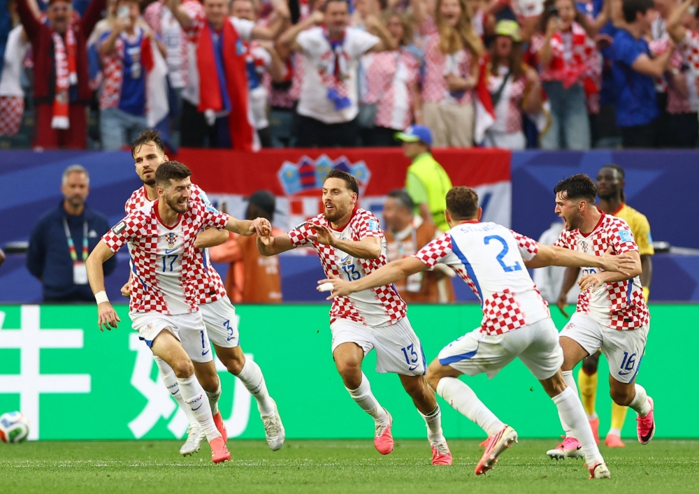  
Croatia's Nikola Vlasic celebrates scoring their second goal with Petar Sucic, Josip Stanisic and Martin Baturina Cziborra