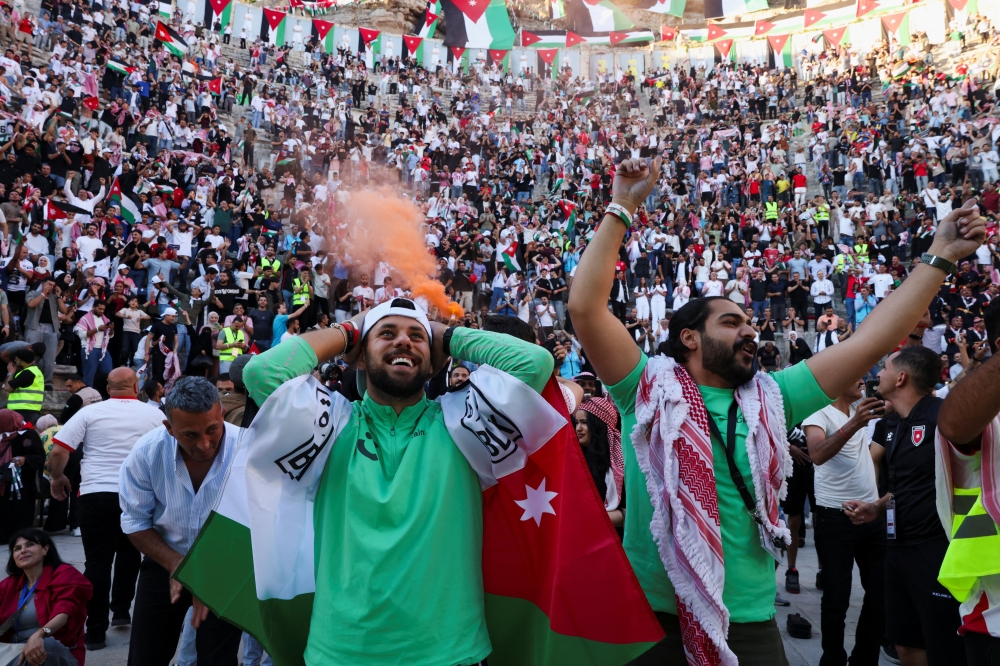 Jordanian fans celebrate after Jordan scores a goal during the FIFA World Cup 2026 match between Jordan and Argentina at the Roman Theatre in Amman 