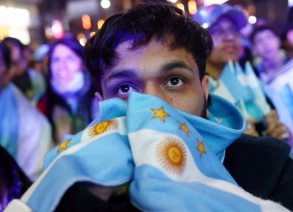 
An Argentina fan watches the match  