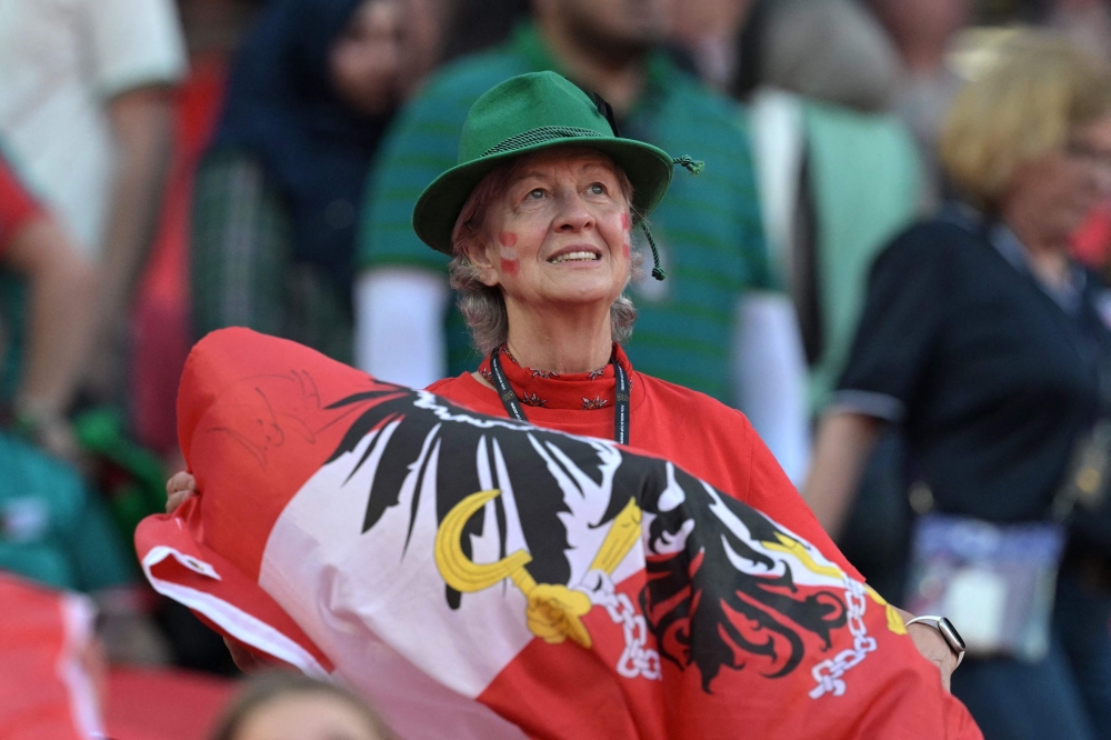 An Austria fan looks on ahead of the 2026 World Cup Group J football match between Algeria and Austria at the Kansas City Stadium in Kansas City  
