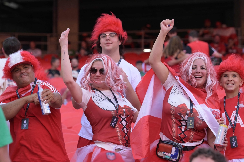 Austria fans gesture ahead of the 2026 World Cup Group J football match between Algeria and Austria at the Kansas City Stadium in Kansas City  
