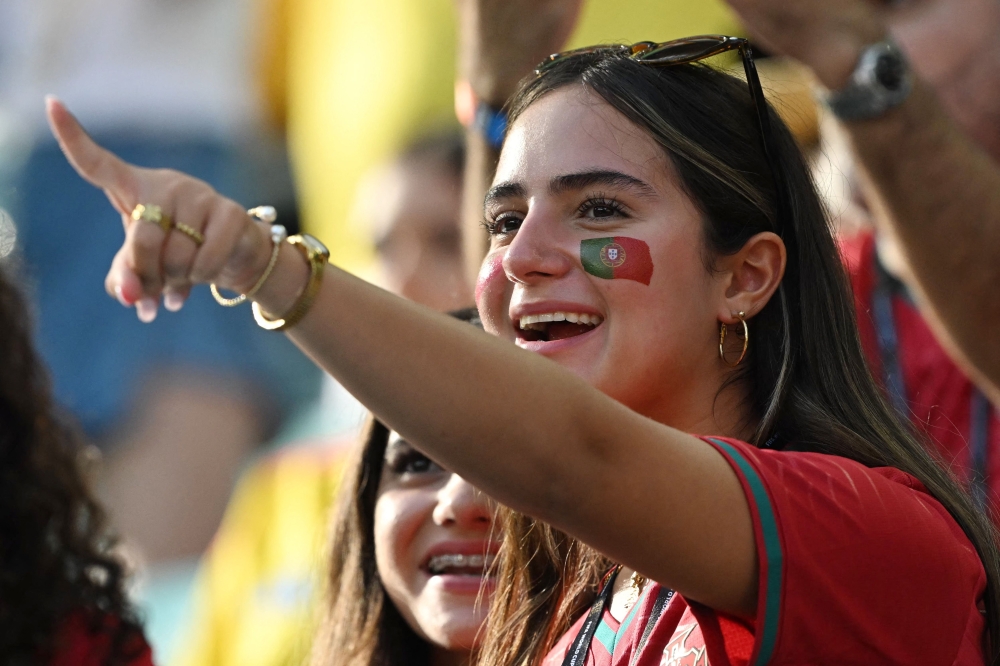 A Portuguese fan gestures ahead of the 2026 World Cup Group K football match between Colombia and Portugal at the Miami Stadium in Miami Gardens  

