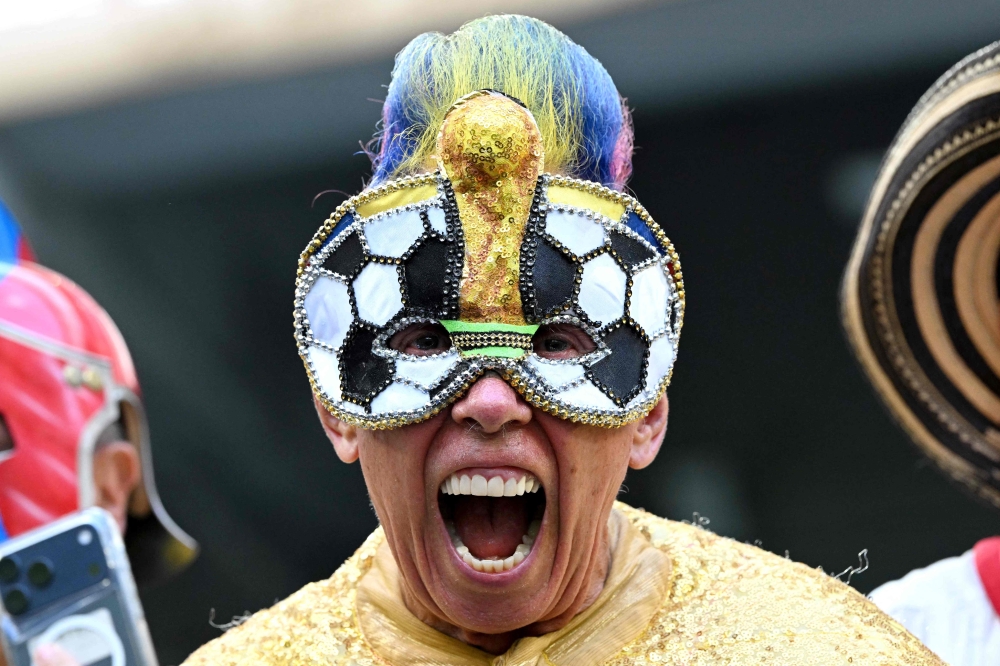 Colombian fan El Cole poses for a photo ahead of the 2026 World Cup Group K football match between Colombia and Portugal at the Miami Stadium in Miami Gardens 

