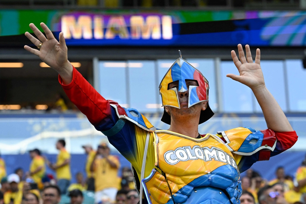 A Colombian fan poses for a photo ahead of the 2026 World Cup Group K football match between Colombia and Portugal at the Miami Stadium in Miami Gardens  