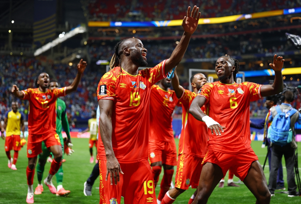  
DR Congo's Mayele and Mukau celebrate after the match. — Reuters 