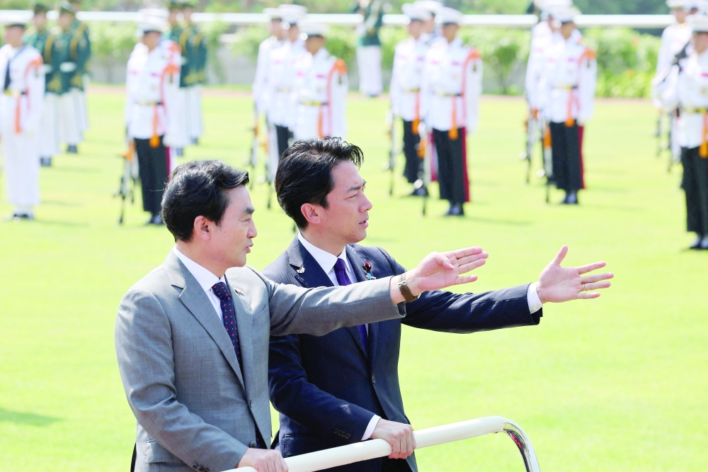 Japanese Defence Minister Shinjiro Koizumi and South Korean Defence Minister Ahn Gyu-back inspect honor guards at the Defence Ministry in Seoul. — Reuters 