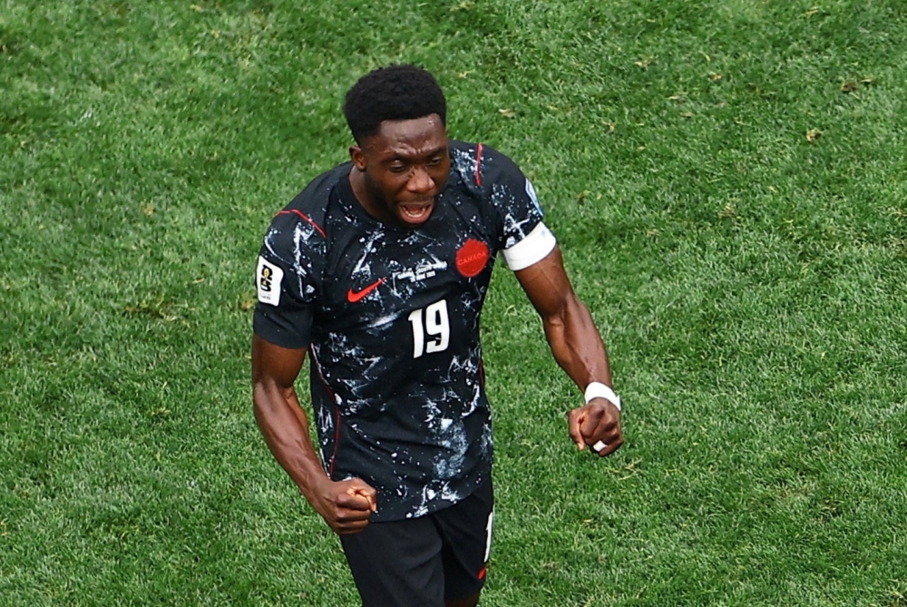 
Canada's Davies celebrates after the match. — Reuters  