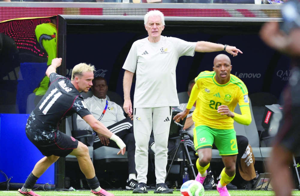 South Africa's Khuliso Mudau in action with Canada's Liam Millar as South Africa coach Hugo Broos reacts. — Reuters