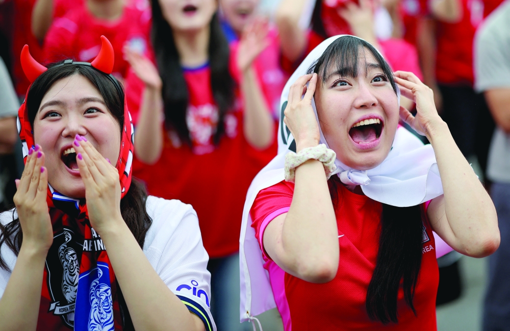 South Korea fans react as they watch the match. — Reuters