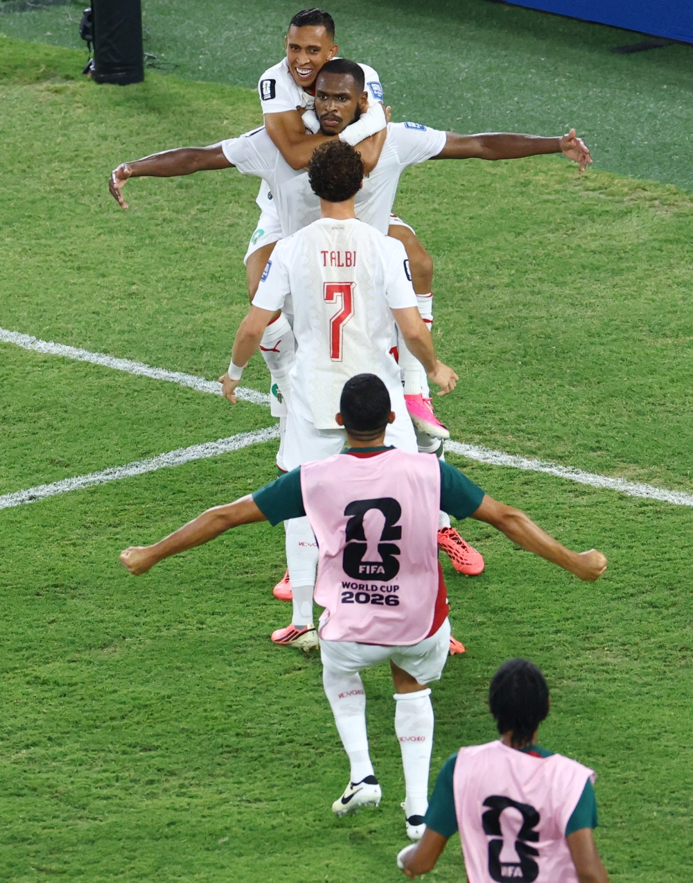  
Morocco's Diop celebrates scoring their first goal with teammates. — Reuters  