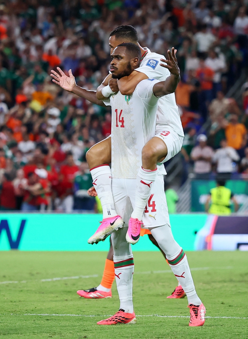  
Morocco's Diop celebrates scoring their first goal with Rahimi. — Reuters  