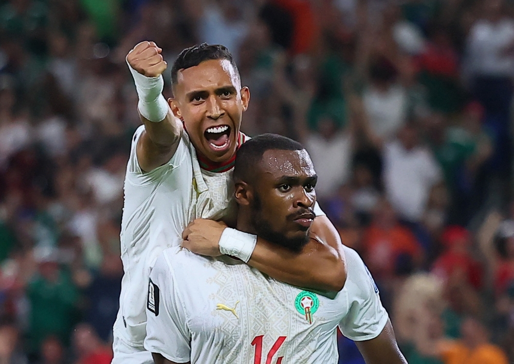 
Morocco's Diop celebrates scoring their first goal with Rahimi. — Reuters