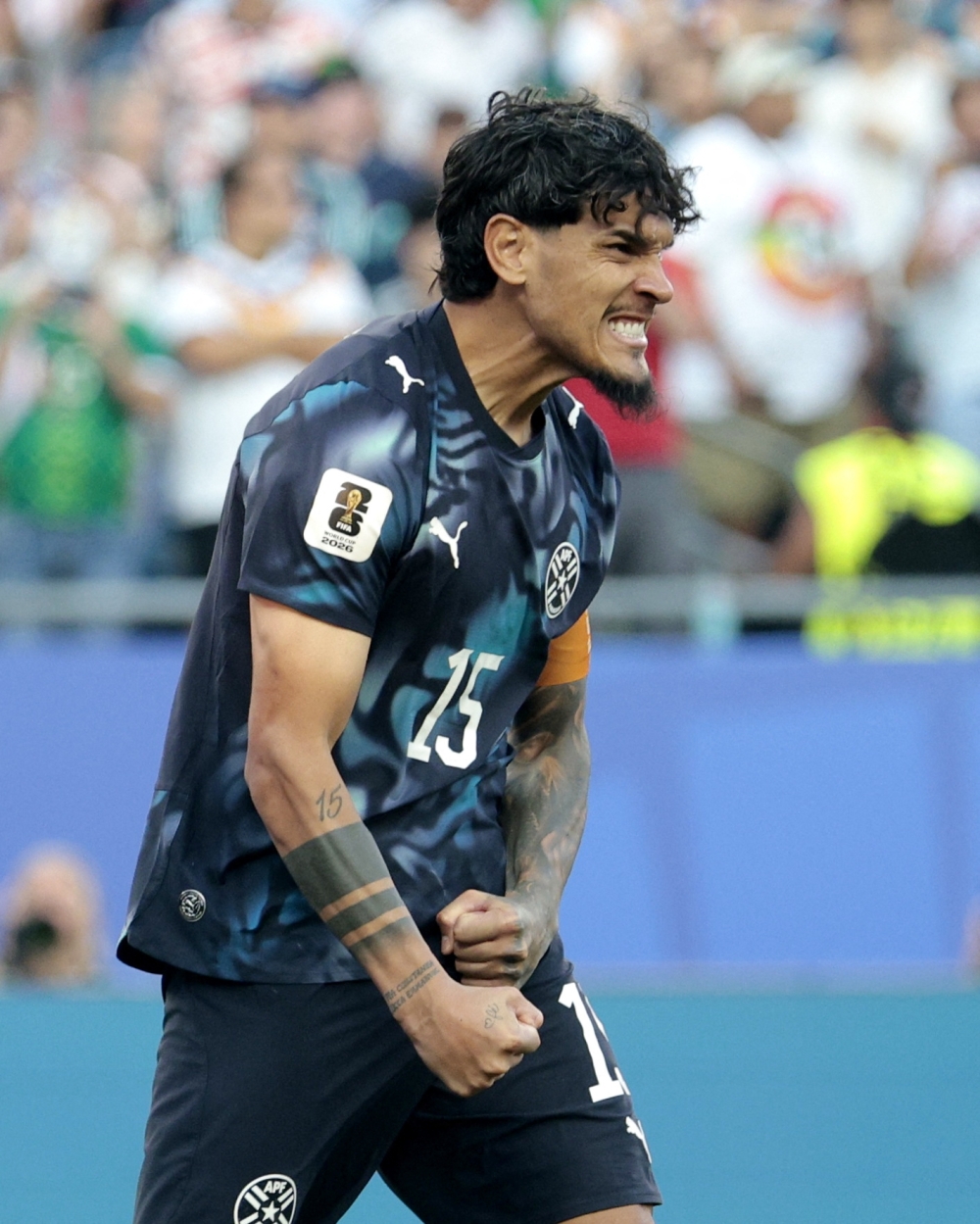  
Paraguay's Gomez celebrates scoring a penalty. — Reuters  